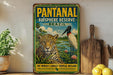 A vintage-style sign for the Pantanal Biosphere Reserve in Brazil, featuring a jaguar and a bird in a tropical landscape.