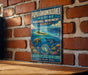A vintage-style metal sign for the Papahanaumokea Marine National Monument in Hawaii, featuring an illustration of a tropical island, sea turtle, and marine life.