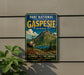 A vintage-style metal sign for the "Parc National de la Gaspée" in Quebec, featuring a reindeer and a mountainous landscape.
