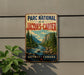 A vintage-style metal sign for the "Parc National de la Jacques-Cartier" in Quebec, Canada, featuring a scenic mountain landscape with a river.