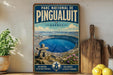 A vintage-style poster of the Pinguait Crater in Quebec, featuring a scenic image of the crater surrounded by mountains and a lake.