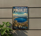 A vintage-style metal sign for the Pinguauit National Park in Quebec, Canada, featuring a scenic image of the park and its surroundings.