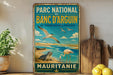 a vintage-style metal sign with a beach scene and birds, placed on a wooden surface next to a wooden cutting board and some lemons.
