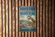 A vintage metal sign for the Parker River National Wildlife Refuge in Massachusetts, featuring a bird and a scenic landscape.