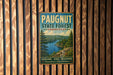A vintage metal sign for Paugnut State Forest in Connecticut, featuring a scenic landscape with pine trees, a lake, and mountains.