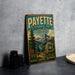 A vintage-style metal sign for the Payette National Forest in Idaho, featuring a scenic mountain landscape and text promoting the area's natural beauty and outdoor activities.
