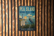A vintage-style metal sign for the Pea Island National Wildlife Refuge in North Carolina, featuring a lighthouse and a bird in the foreground.