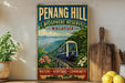 a vintage-style poster of Penang Hill, Malaysia, with a train passing through a lush, tropical landscape.