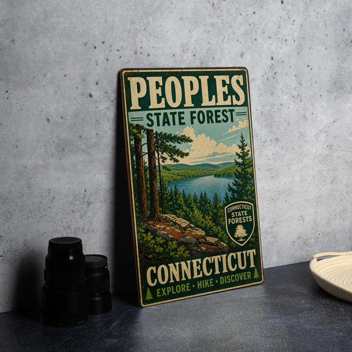A vintage-style metal sign for the People's State Forest in Connecticut, featuring a scenic landscape with pine trees, a lake, and mountains.