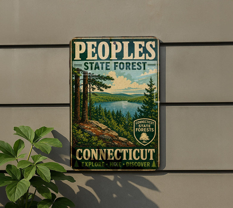 A vintage-style sign for the People's State Forest in Connecticut, featuring a scenic landscape with pine trees, a lake, and mountains.