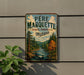 A vintage-style metal sign with the text "PERE MARQUETTE STATE FOREST MICHIGAN" displayed on a wall, depicting a scenic forest landscape with a river and pine trees.