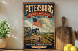A vintage-style metal sign for the Petersburg National Battlefield in Virginia, featuring an American flag and a cannon, with the text "Preserving Our Nation's History" and "Established 1933".