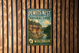 A vintage metal sign for the Pewits Nest State Natural Area in Wisconsin, featuring a scenic illustration of a river and forest landscape.