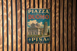 A vintage-style metal sign with the text "PIZZA DEL DUOMO" and "PIESA ITALY" is displayed on a wooden wall.