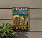 A vintage metal sign with the text "PIZZA DEL DUOMO PISÀ ITALY" and an illustration of the Leaning Tower of Pisa, a famous landmark in Italy.