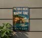 A vintage-style sign for the Pictured Rocks National Lakeshore Marine Zone in Michigan, featuring a scenic image of a boat on the water and a rocky arch in the background.