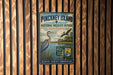 A vintage-style metal sign for the Pinckney Island National Wildlife Refuge in South Carolina, featuring an illustration of a bird and a body of water.