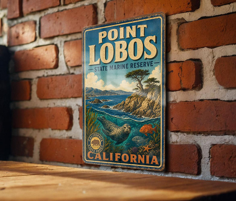 A vintage metal sign for Point Lobos State Marine Reserve in California, featuring an illustration of a rocky coastline, a seal, and a fish.