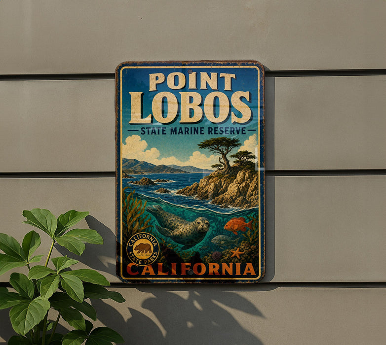 A vintage metal sign for Point Lobos State Marine Reserve, featuring a scenic illustration of the bay and mountains.