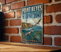 A vintage-style metal sign for Point Reyes National Seashore Marine Zone in California, featuring a lighthouse, seal, and ocean scene.