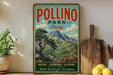 A vintage-style poster of Pollino Park in Italy, featuring a scenic mountain landscape with a pine tree and flowers, is displayed on a wall next to a wooden cutting board and some potted plants.