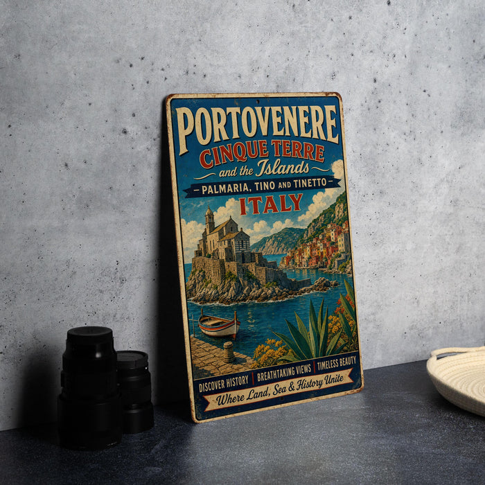 A vintage metal sign advertising Portovenere and Cinque Terre, Italy, with a scenic illustration of the island and its surroundings.