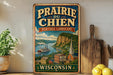 a vintage-style sign for Prairie du Chien, Wisconsin, with a scenic illustration of a river, buildings, and a church.