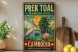 a vintage metal sign with a colorful illustration of a pelican and a pond, along with text that reads "Prey Toal Ramsar Site Cambodia Protect our wetlands heritage".