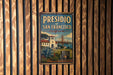 A vintage metal sign with the text "PRESIDIO OF SAN FRANCISCO CALIFORNIA" and a picture of a building and bridge, hanging on a wooden wall.