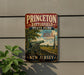 A vintage metal sign for Princeton Battlefield State Park, featuring a cannon and a scenic landscape.