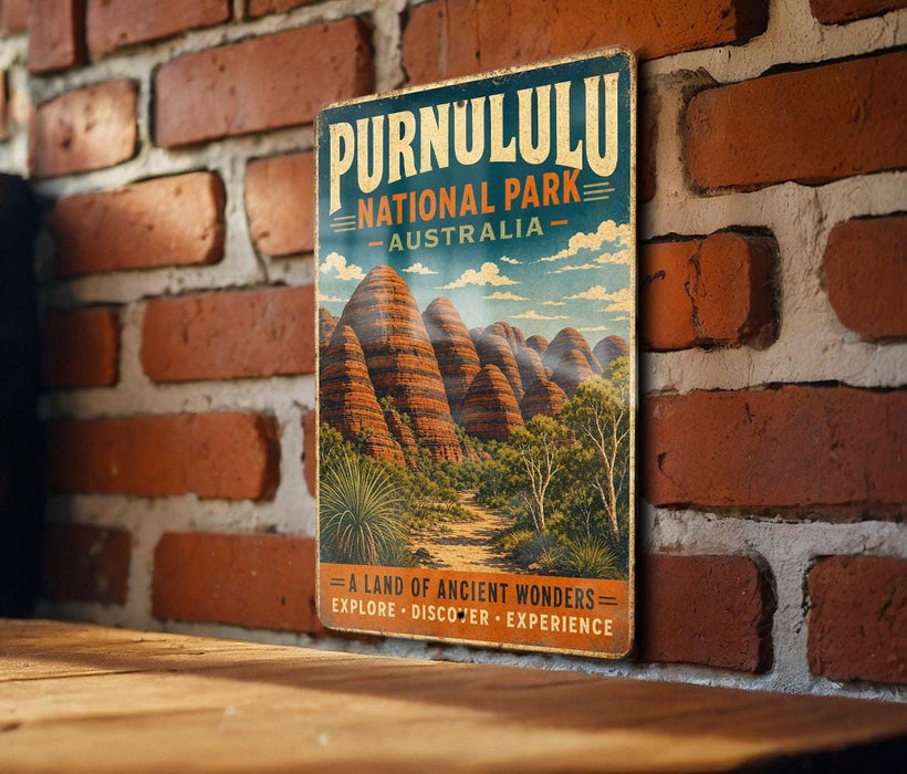 A vintage-style sign for Purnululu National Park in Australia, featuring a scenic illustration of the park's iconic rock formations.