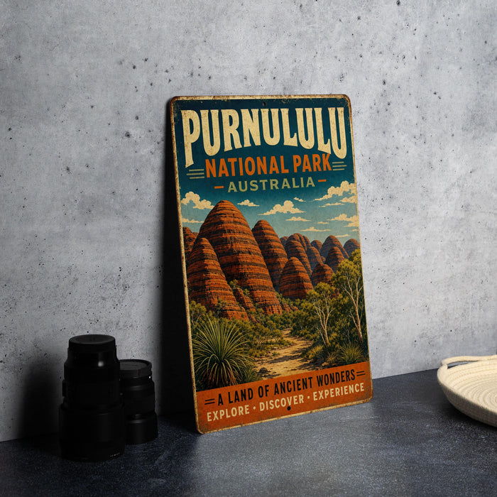 A vintage-style poster advertising Purnululu National Park in Australia, featuring a scenic illustration of the iconic rock formations.
