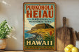 A vintage-style sign for Puukohola Heiau, the National Historic Site in Hawaii, featuring a tropical landscape with a castle and palm trees.