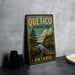 A vintage-style metal sign for Quetico Provincial Park in Ontario, featuring a scenic illustration of a lake, pine trees, and a canoe.