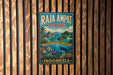 A vintage metal sign for Raja Ampat Park in Indonesia, featuring a tropical island landscape with palm trees, colorful fish, and a blue sky.