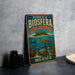A vintage-style metal sign with the text "RESERVA DE LA BIOSFERA BANCO CHINCHORRO MEXICO" and an illustration of a turtle swimming in the ocean.