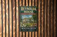 A vintage metal sign for the Reynolds House Museum of American Art in Winston-Salem, North Carolina.