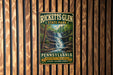 A vintage-style metal sign for Ricketts Glen State Park in Pennsylvania, featuring a waterfall and forest scenery.