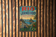 A vintage metal sign for Rio de Janeiro, Brazil, featuring a colorful illustration of the city's landscapes and landmarks.