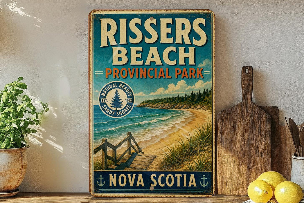 A vintage-style metal sign for Rissers Beach Provincial Park in Nova Scotia, featuring a scenic beach landscape with a wooden walkway leading to the shore.