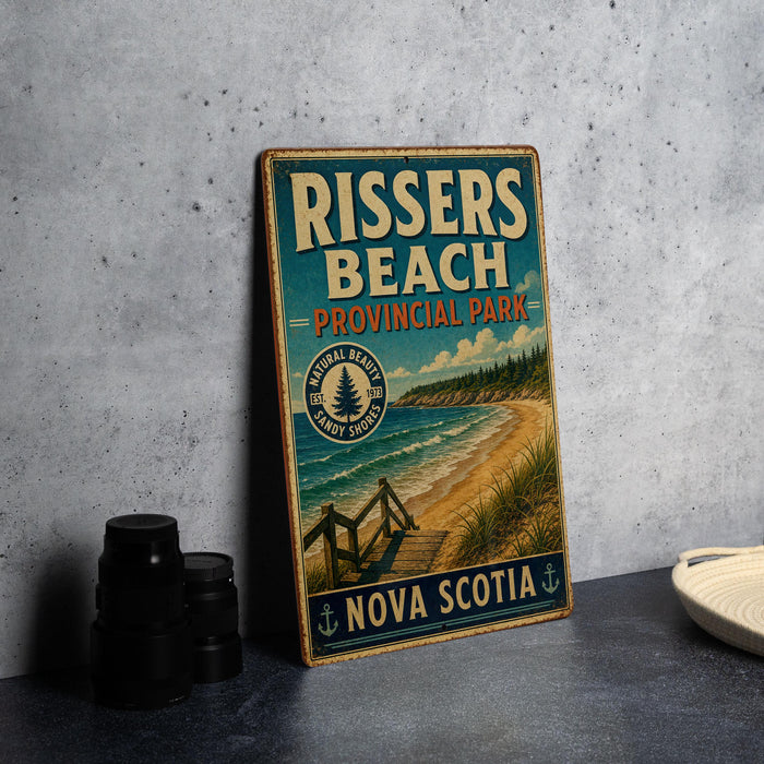 A vintage-style sign for Rissers Beach, a coastal park in Nova Scotia, Canada.