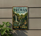 A vintage-style metal sign for Robert H. Treman State Park in New York, featuring a scenic waterfall and lush greenery.