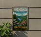 A vintage-style metal sign for Rothrock State Forest in Pennsylvania, featuring a scenic landscape with pine trees, a lake, and mountains.