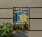 A vintage metal sign on a wall, displaying a map of the Routes of Santiago de Compostela in France, with a person in the background.