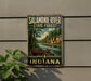 A vintage-style metal sign for the Salamonie River State Forest in Indiana, featuring a canoe on a river surrounded by trees and mountains.