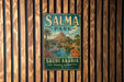 A vintage metal sign for Salma Park in Saudi Arabia, featuring a tropical landscape with palm trees and a waterfall.