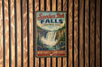 A vintage-style metal sign for Samba Deh Falls, a waterfall located in Northwest Territories, Canada.
