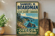 A vintage-style metal sign for the State Scenic Corridor in Oregon, featuring a scenic coastal landscape with mountains, cliffs, and the ocean.