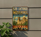 A vintage-style sign for San Antonio Missions National Historical Park, featuring an illustration of the Mission bells and buildings, with the text "SAN ANTONIO MISSIONS" prominently displayed.