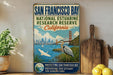 A vintage-style sign for the National Estuarine Research Reserve in San Francisco Bay, featuring a seagull, a bridge, and a city skyline.
